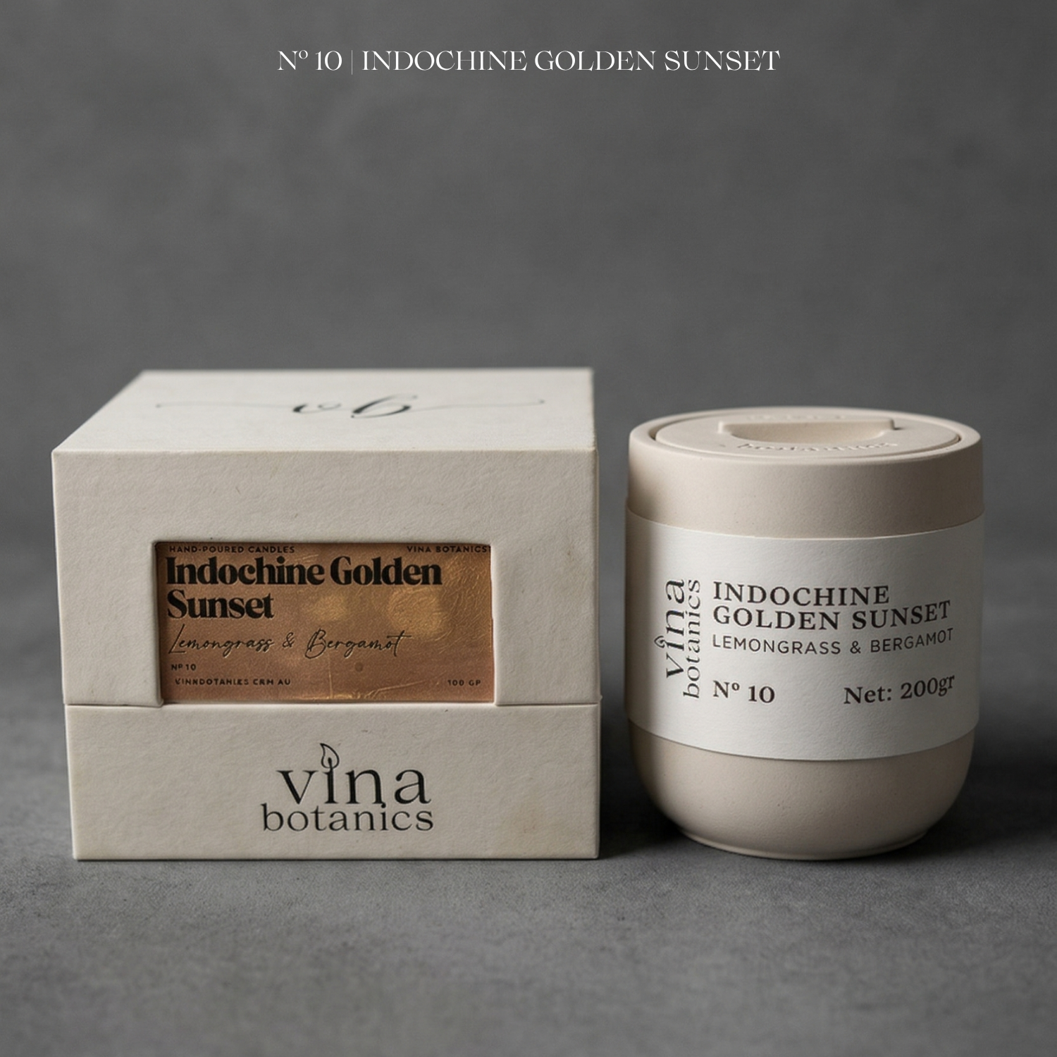 Vina Botanics Indochine Golden Sunset candle and packaging on a gray background
