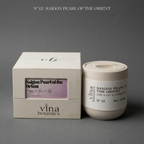 Vina Botanics Saigon Pearl of the Orient candle and packaging on a gray background