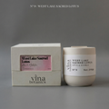 Vina Botanics West Lake Sacred Lotus candle and packaging on a gray background