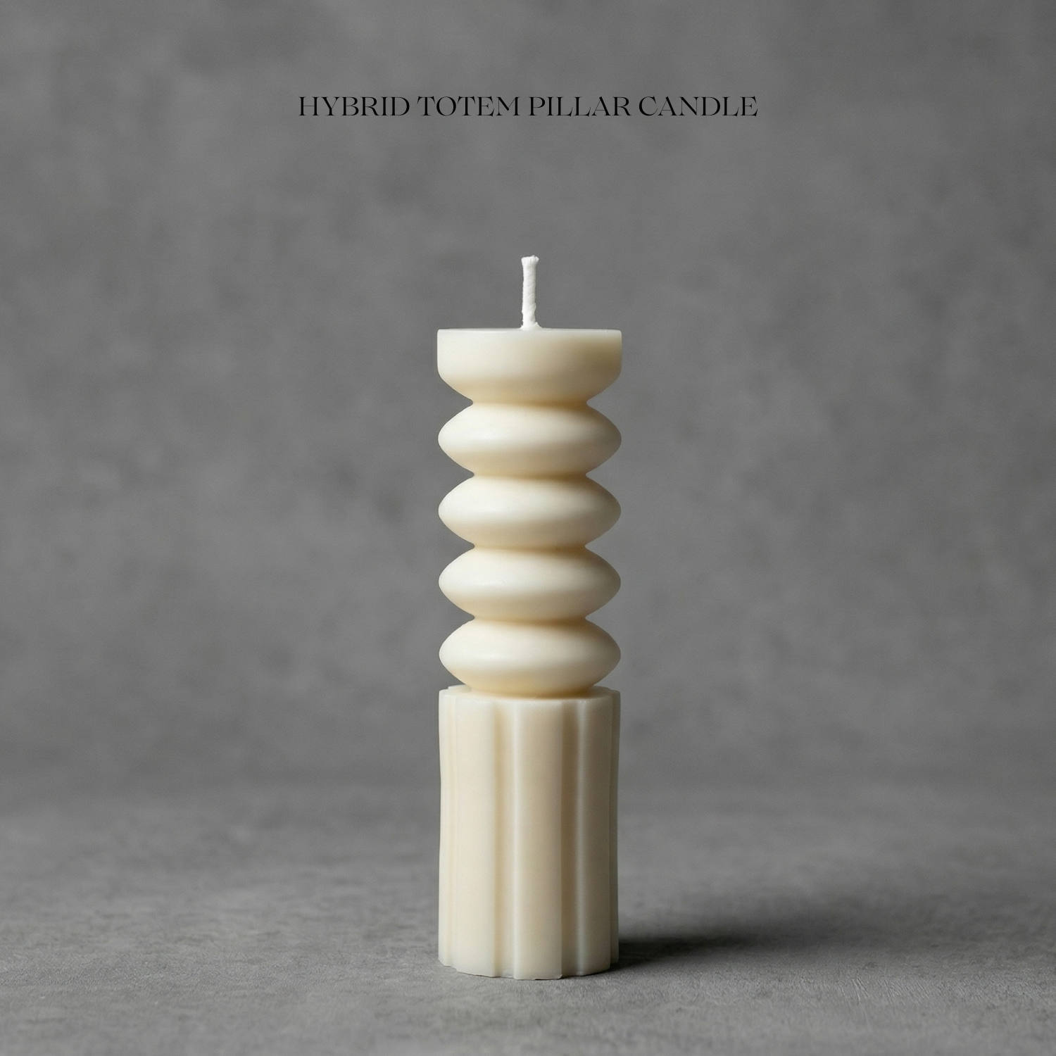 Hybrid totem pillar candle on a gray background