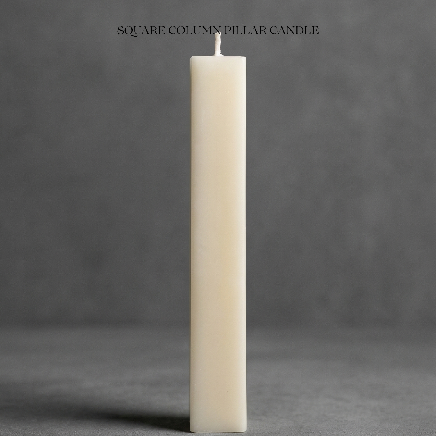 Beige square column pillar candle on a gray background