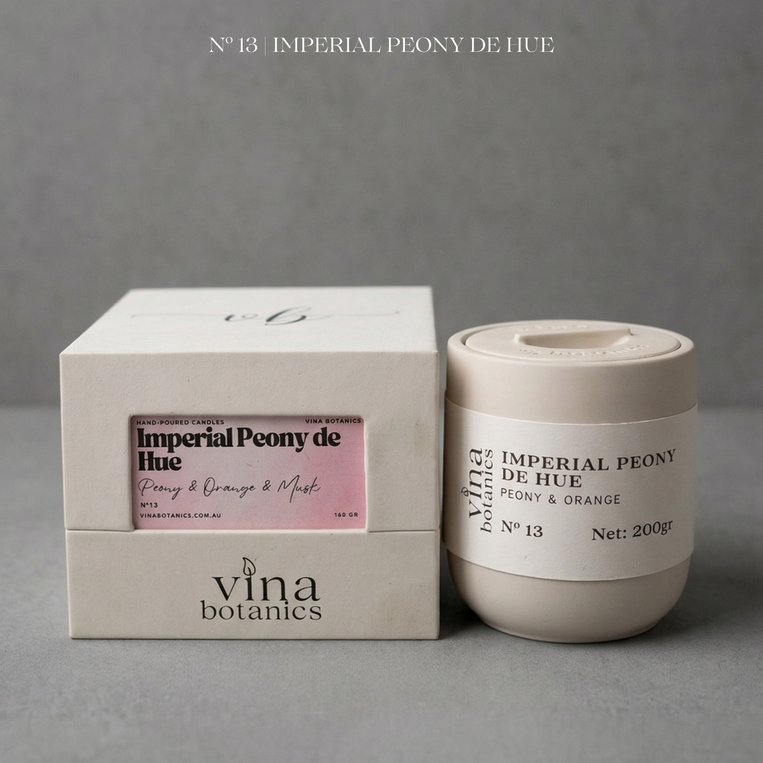Vina Botanics Imperial Peony de Hue candle with packaging on a gray background