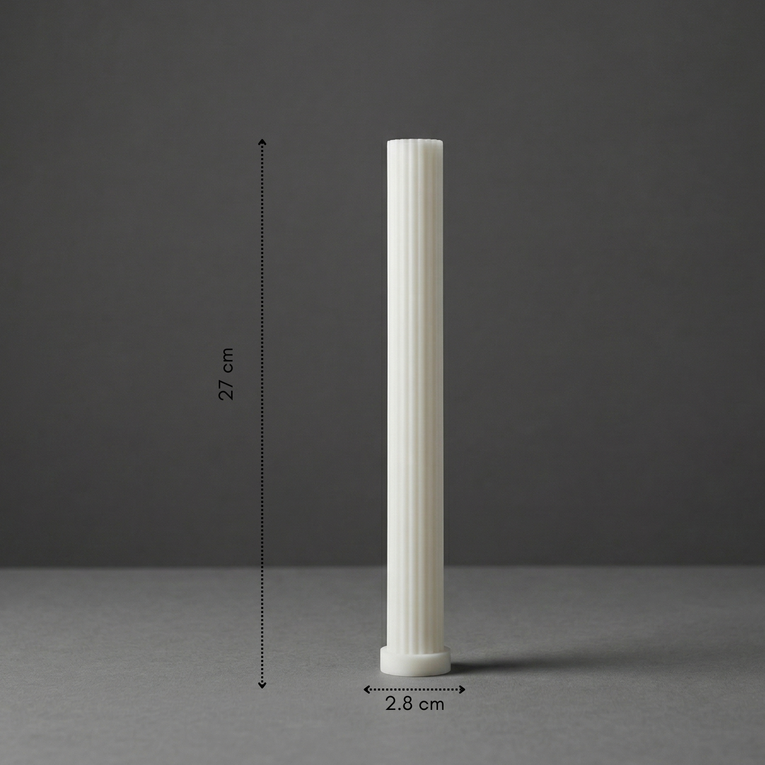 White cylindrical object with measurements on a gray background