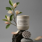 Candle with 'West Lake Sacred Lotus' label on a gray background
