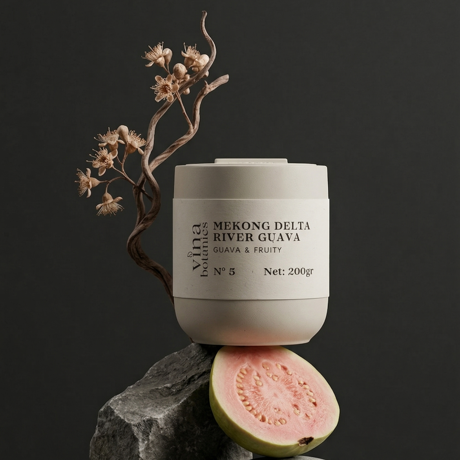 Jar of Mekong Delta River Guava on a dark background with a guava and branch.