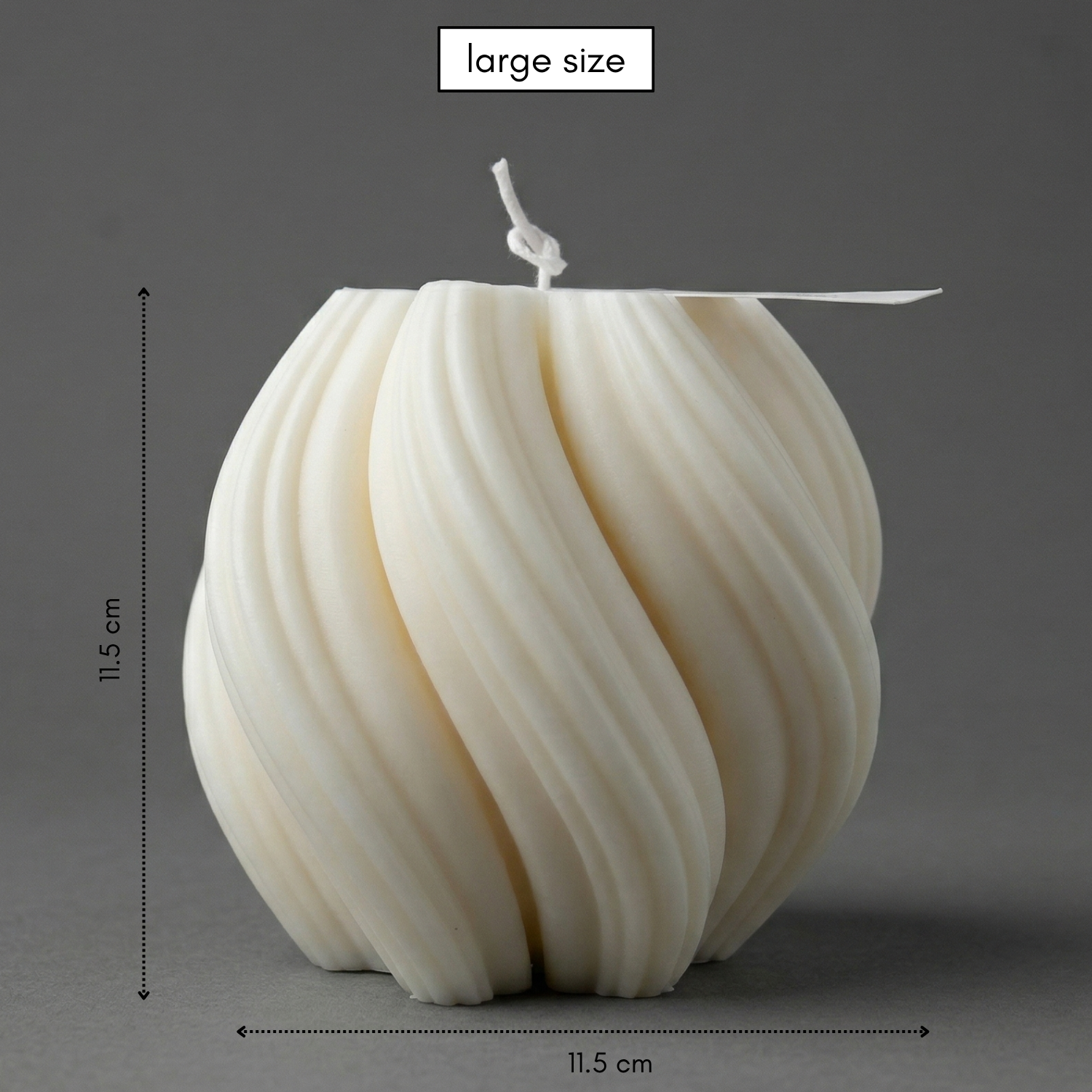 Large white candle with ribbed texture on a gray background, showing dimensions.