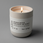 Candle in a white container with a label on a gray background
