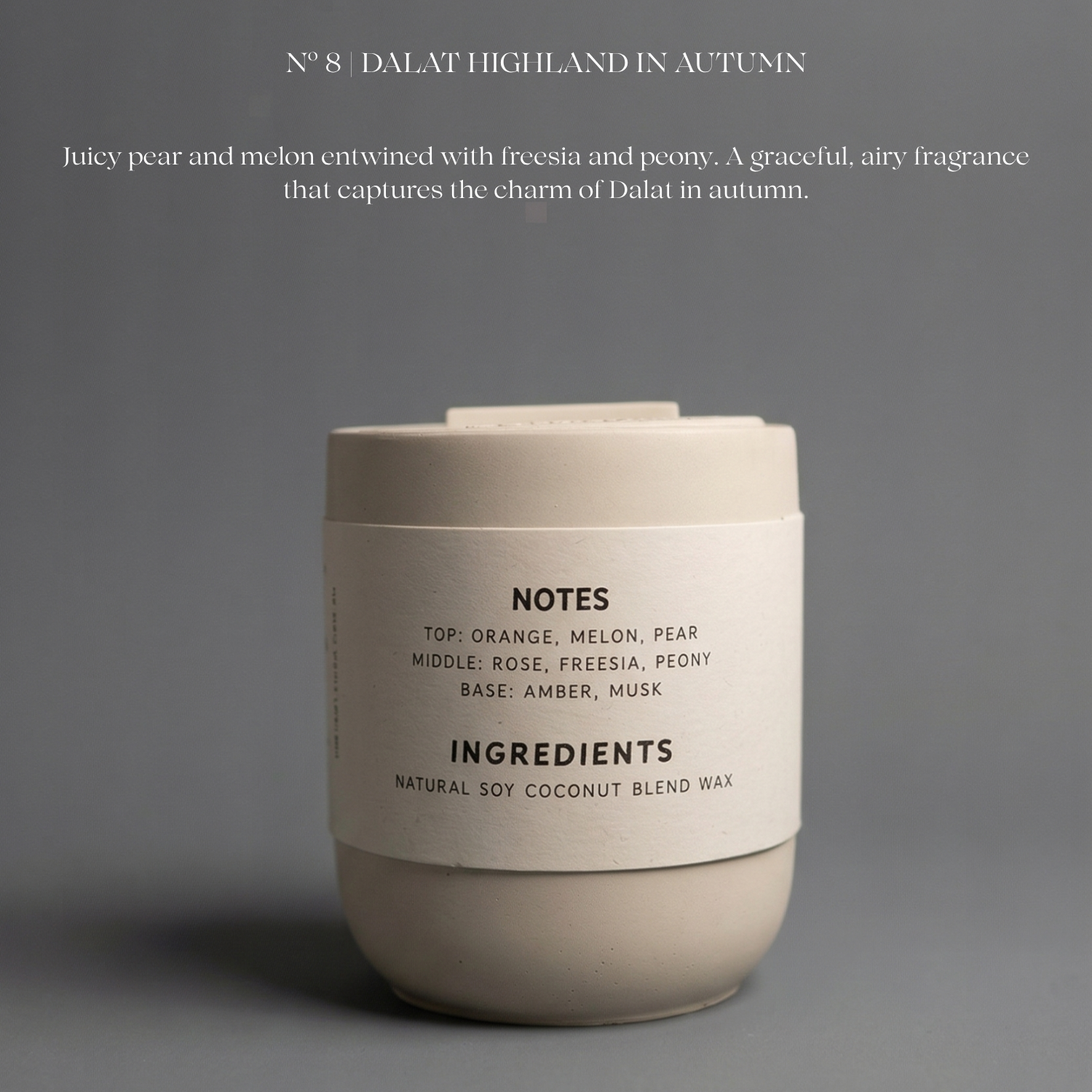Candle with label on a gray background