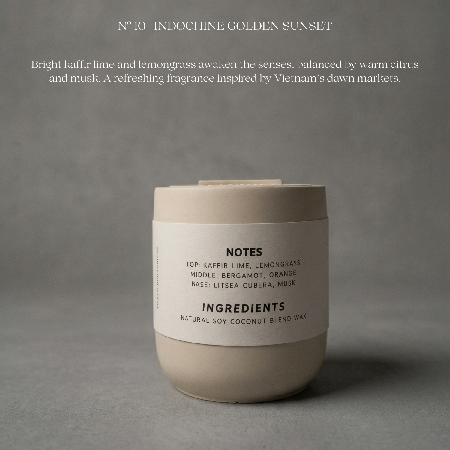 Candle with label on a gray background