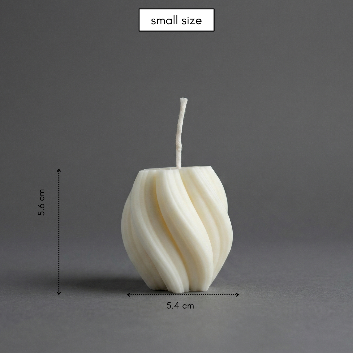 Small white candle with dimensions on a gray background