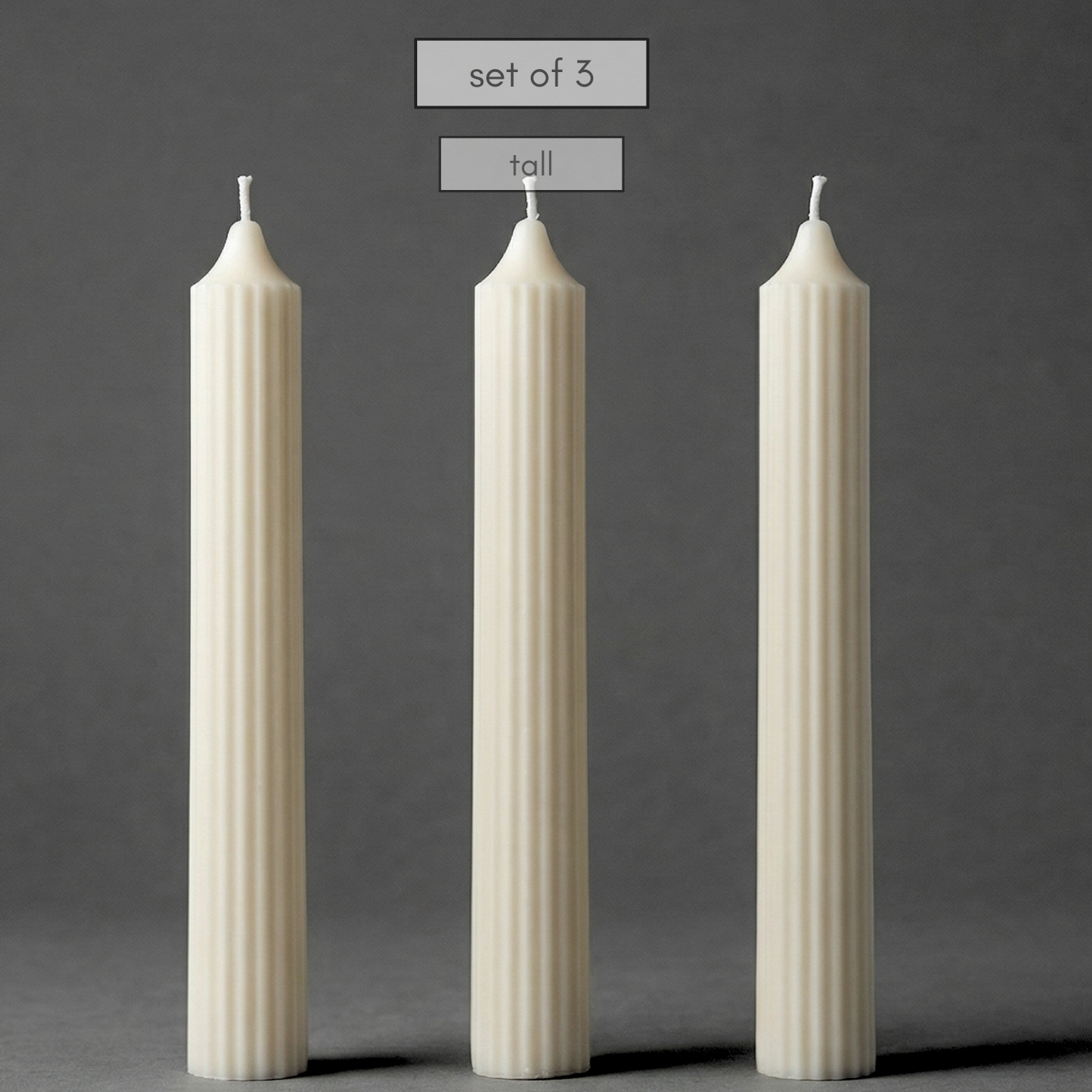 Three white textured candles on a gray background with text indicating 'set of 3' and 'large size'.