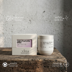 Vina Botanics candles on a wooden surface with a neutral background