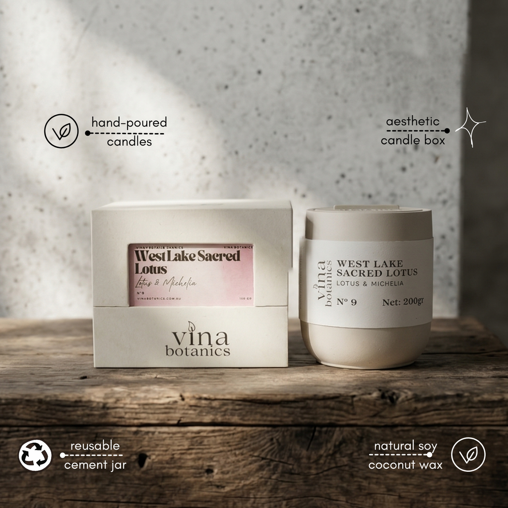 Vina Botanics candle and packaging on a wooden surface with a neutral background