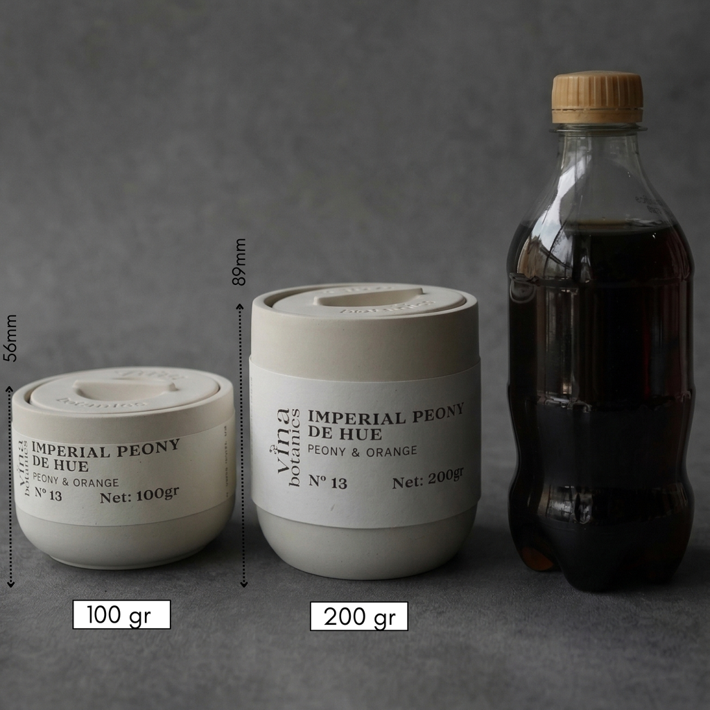 Two cylindrical containers with labels and a bottle on a gray background, showing measurements and weights.