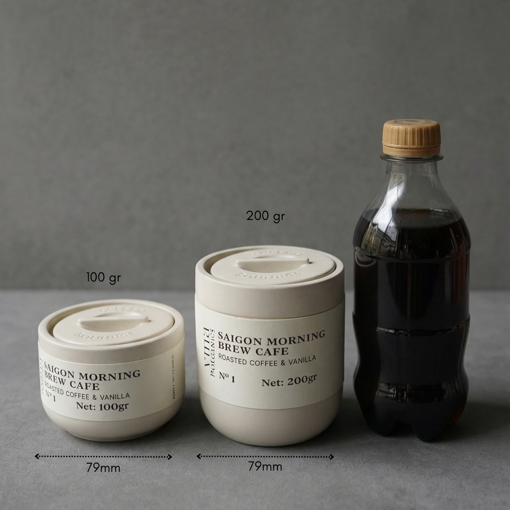 Two containers labeled 'Saigon Morning Brew Cafe' and a bottle on a gray surface with a dark background.
