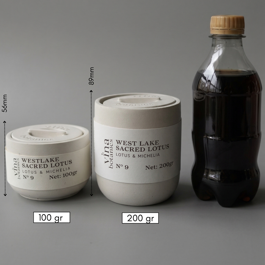 Two containers labeled 'West Lake Sacred Lotus' with measurements and a bottle of dark liquid on a gray background.